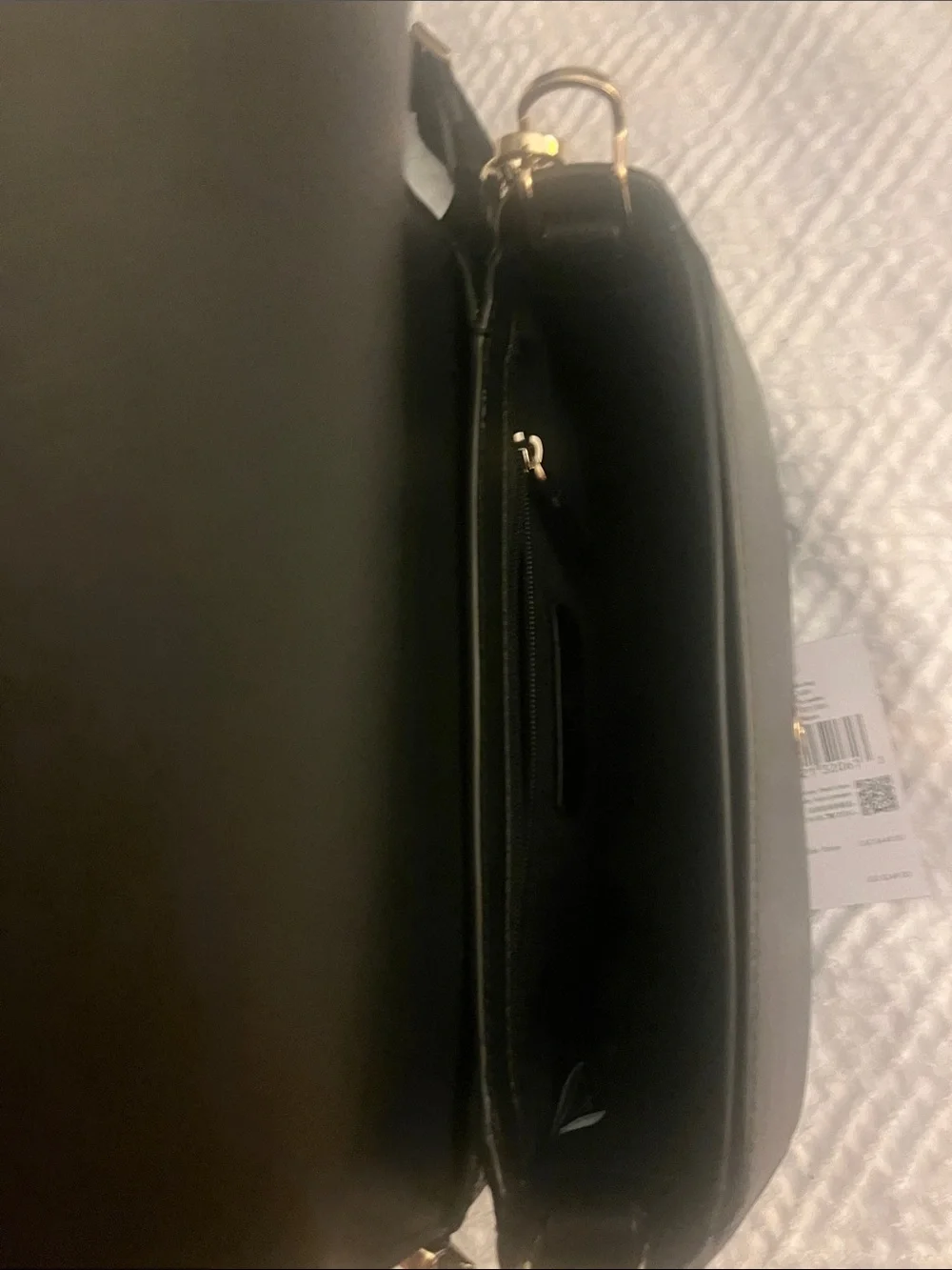 Kate Spade black crossbody saddlebag with gold logo